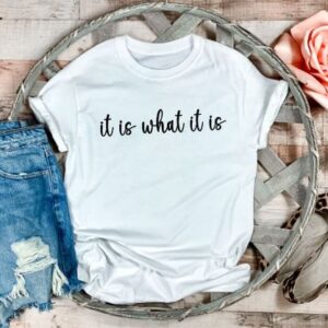 Ladies white t-shirt with the slogan it is what it is printed in black