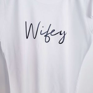 Ladies white t-shirt with the word Wifey printed in a crisp black colour
