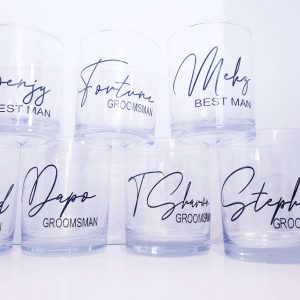 A group of 7 whiskey tumblers, personalised with name and wedding role