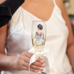 Bride holding a flute glass with a bride image and the word bride in black.